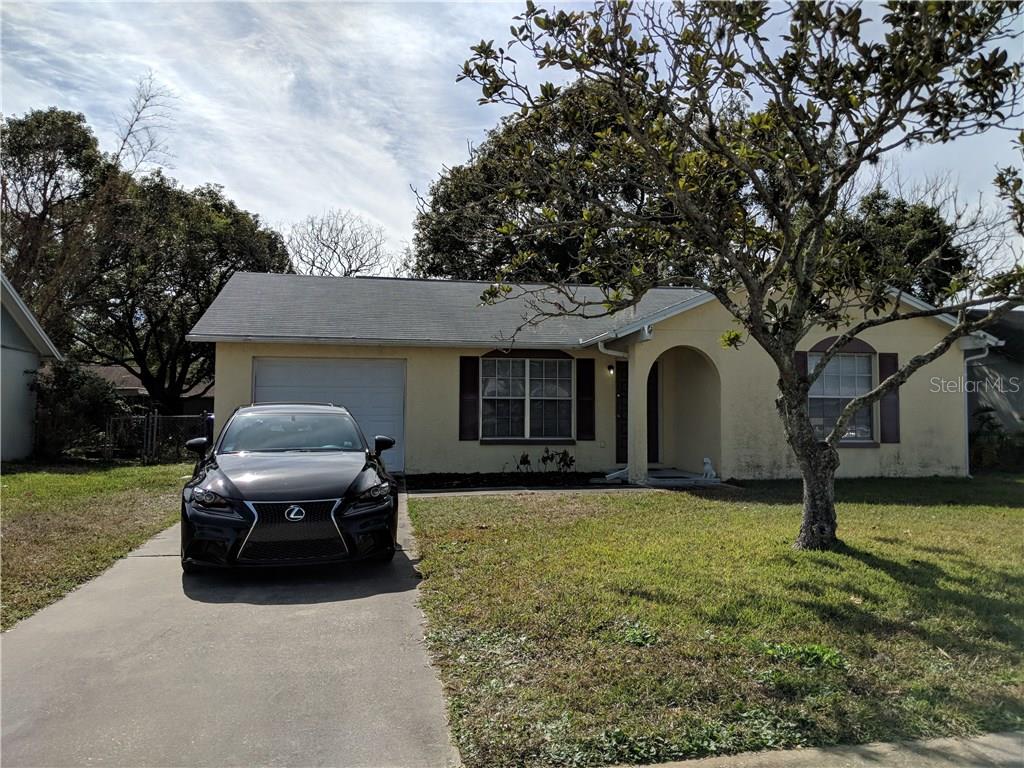 7442 Jenner Avenue New Port Richey, FL 34655 - Photo 1 of 1 a house view with a garden space