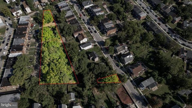 an aerial view of multiple houses with yard