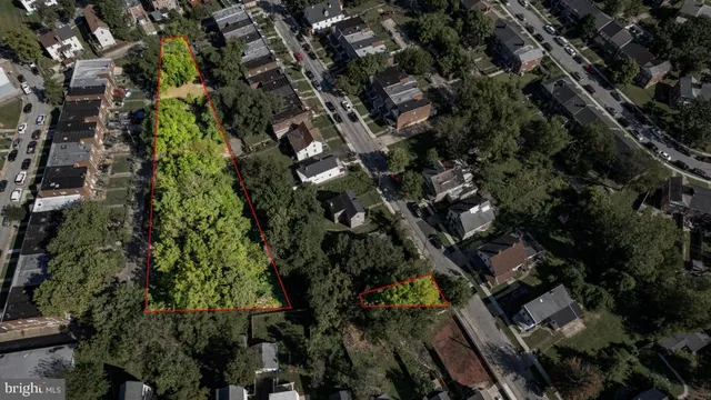 an aerial view of multiple houses with yard