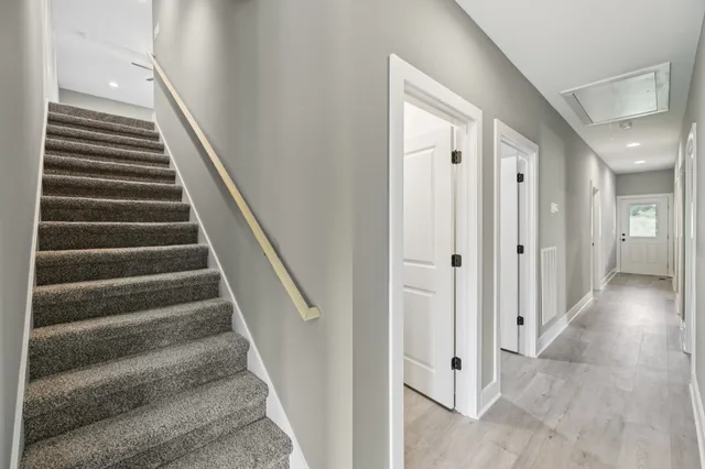 a view of an entryway with wooden floor