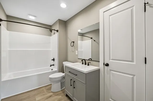 a bathroom with a toilet a sink and a bathtub