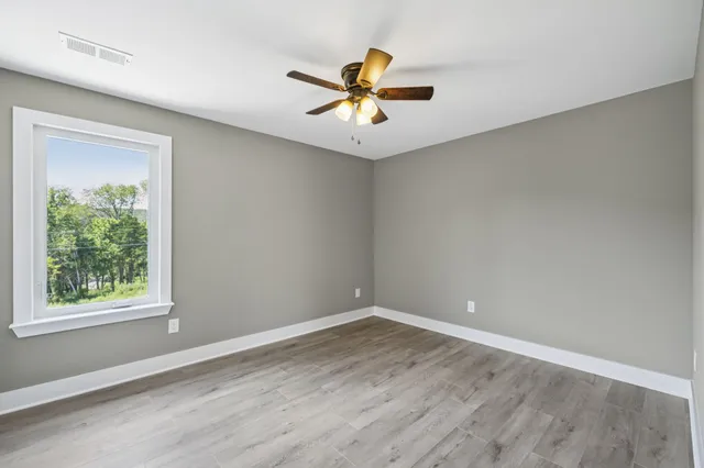 wooden floor in a room with a window