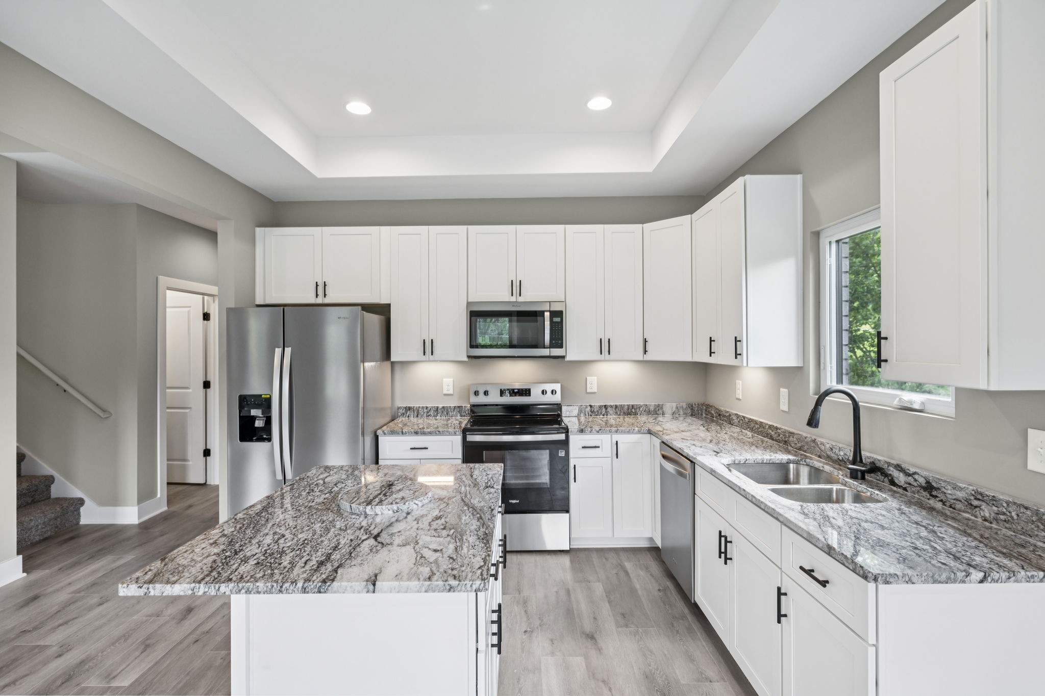 1825 Shop Springs Road Watertown, TN 37184 - Photo 9 of 25 a kitchen with refrigerator a sink and cabinets