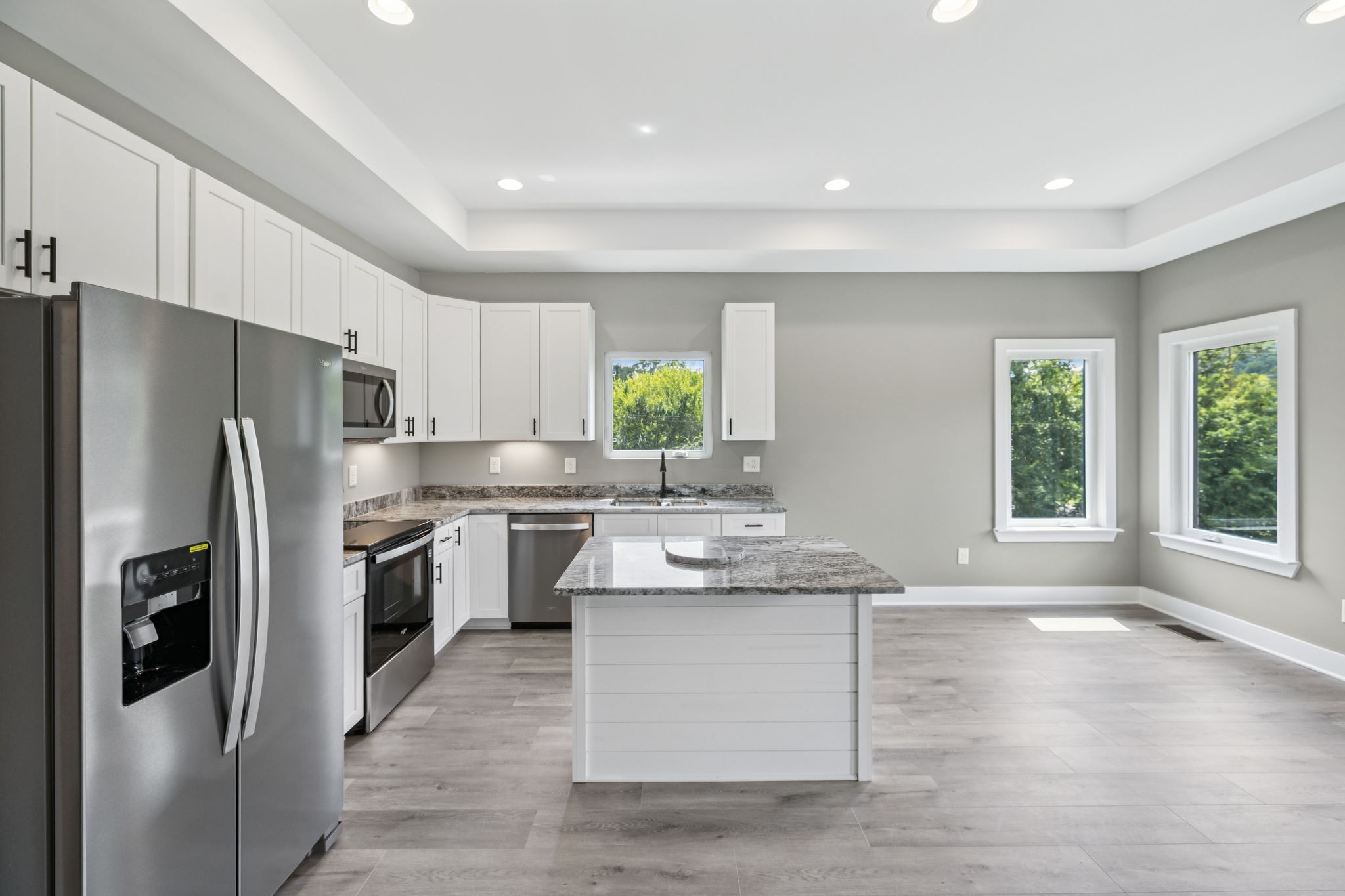 1825 Shop Springs Road Watertown, TN 37184 - Photo 10 of 25 a kitchen with stainless steel appliances granite countertop a refrigerator sink and stove