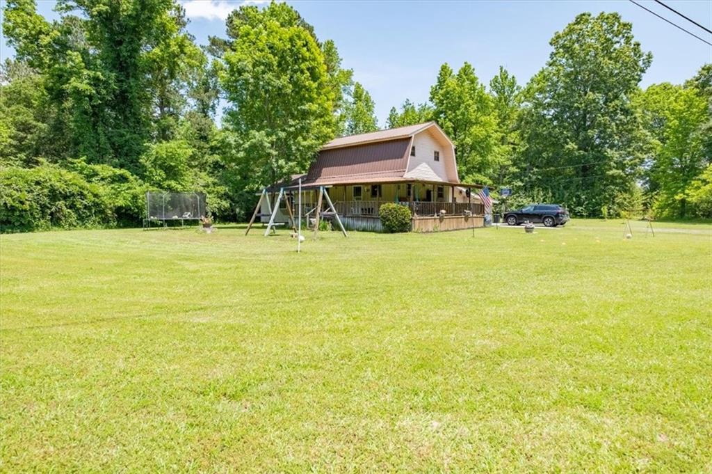 2 Dwyatt Street Northeast Rome, GA 30165 - Photo 1 of 1 a swimming pool with outdoor seating and yard