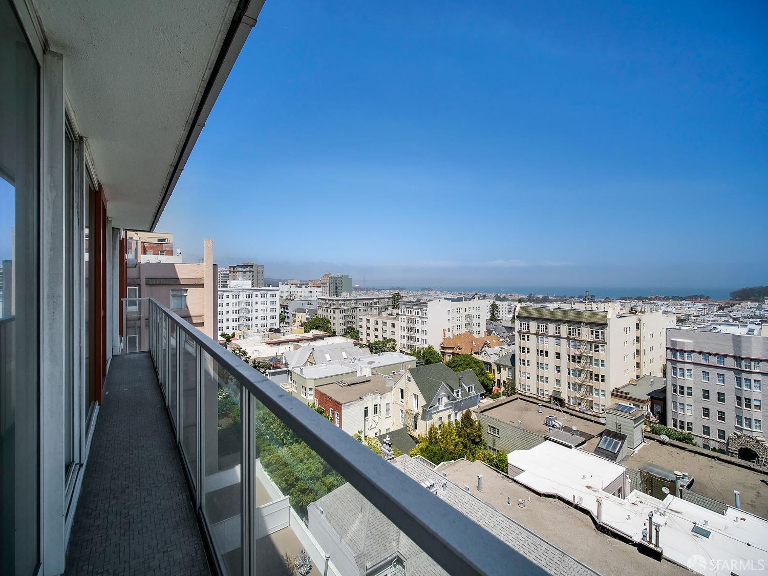1800 Pacific Avenue, Unit 701 San Francisco, CA 94109 - Photo 13 of 36 a city view from a balcony with furniture