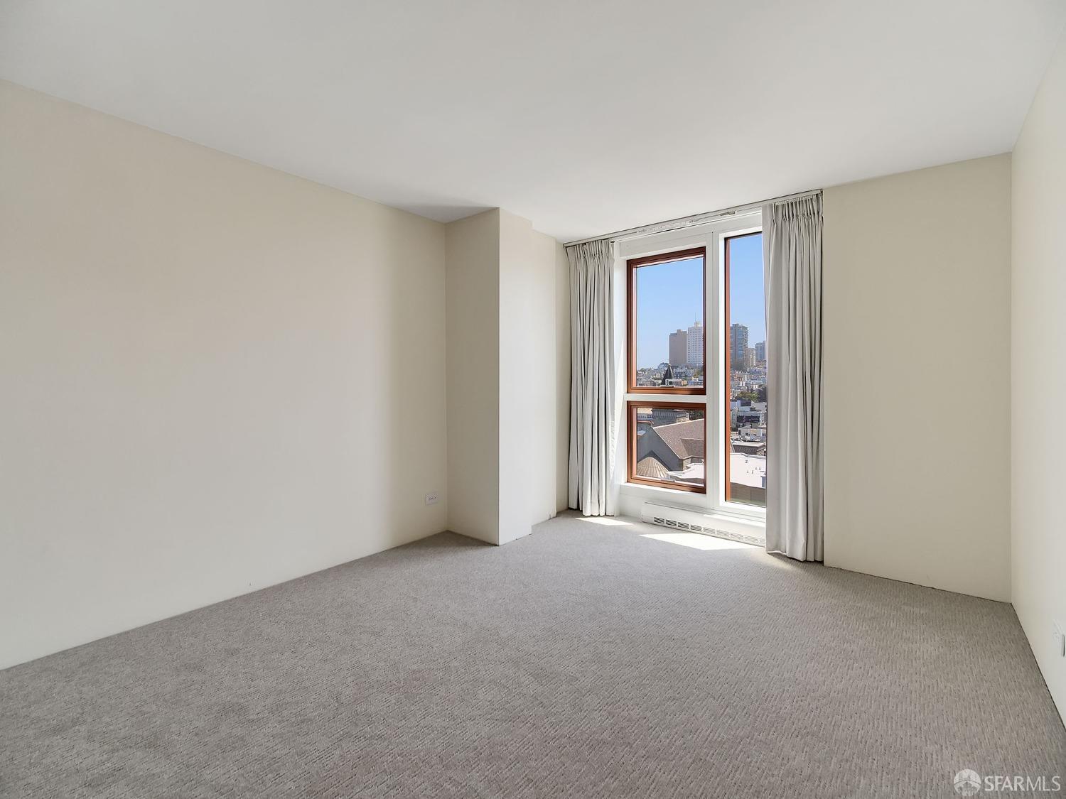 1800 Pacific Avenue, Unit 701 San Francisco, CA 94109 - Photo 19 of 36 a view of a room with a window and kitchen view