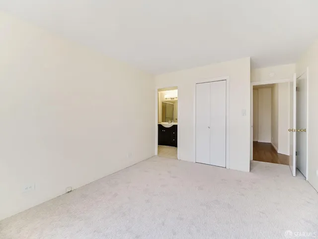 a view of an empty room and closet