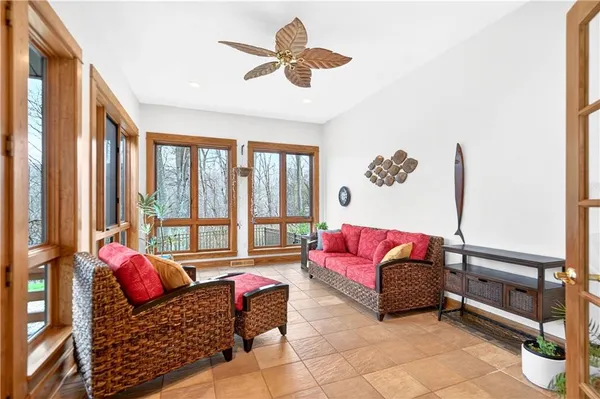 a living room with furniture or couch and a large window