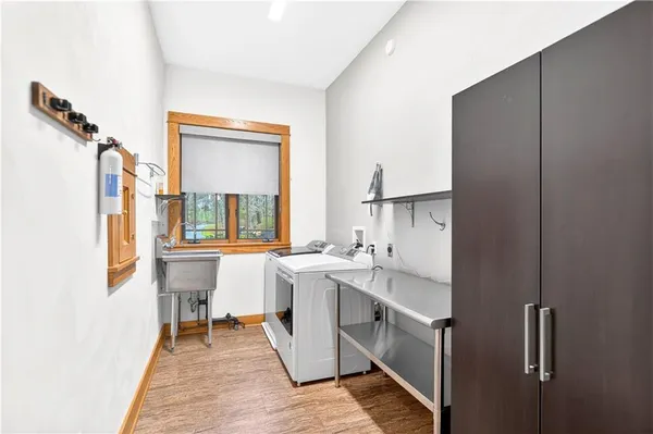 a bathroom with a sink toilet and a mirror