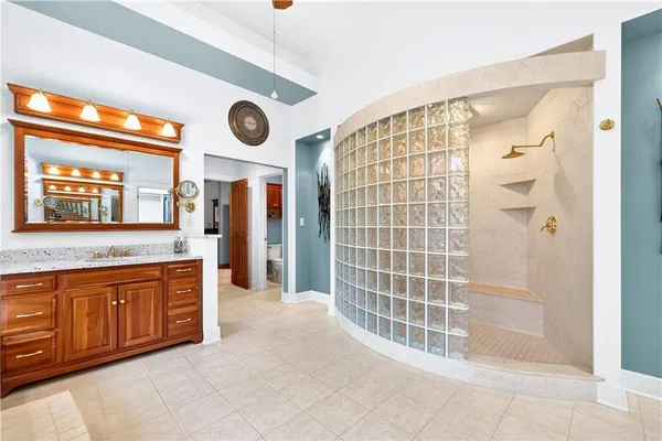 a spacious bathroom with a double vanity sink and a bathtub