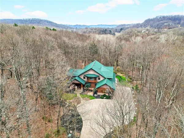 a house with green field in front of it