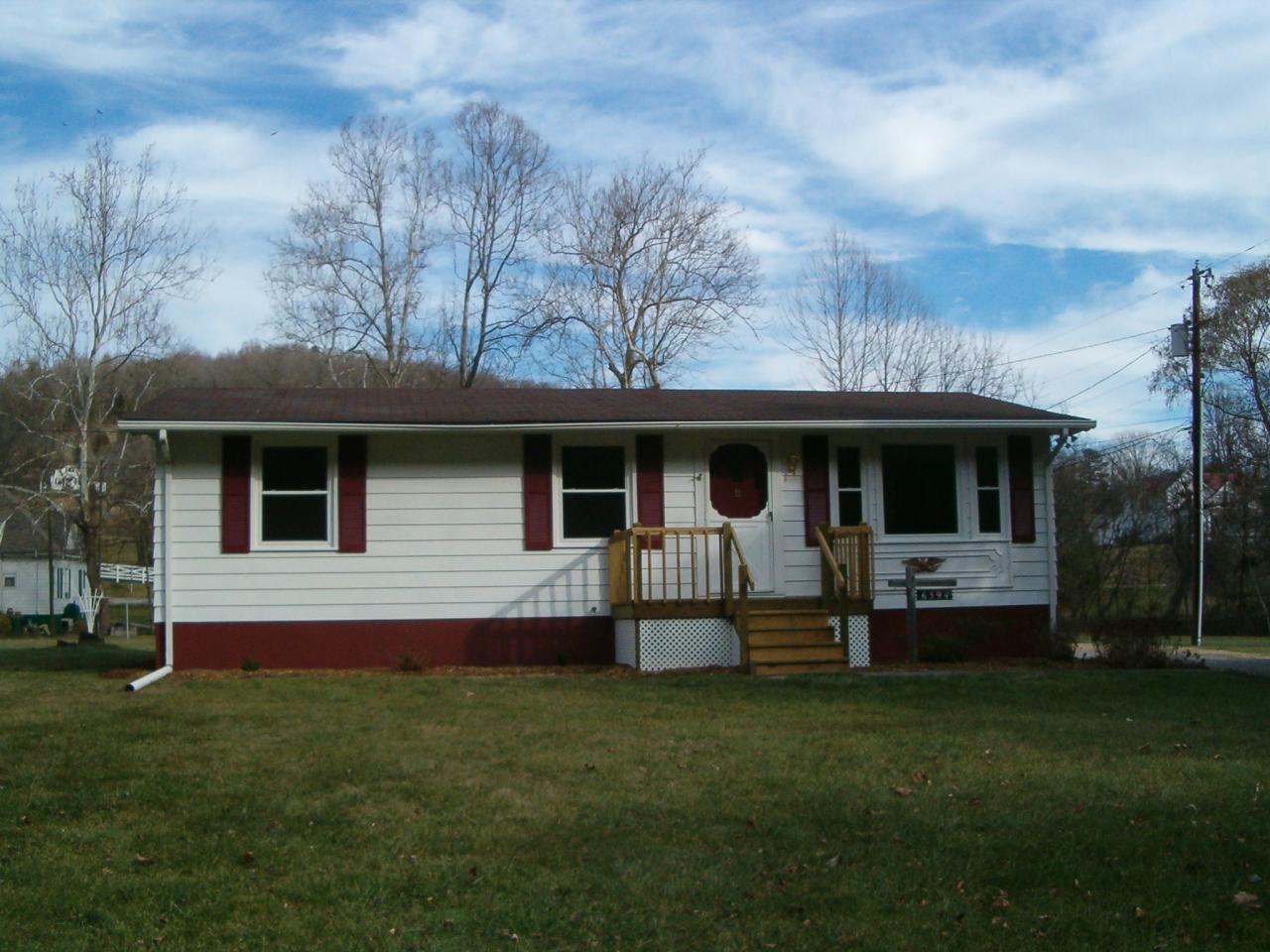6594 Roanoke Road Shawsville, VA 24162 - Photo 1 of 7 a front view of house with yard