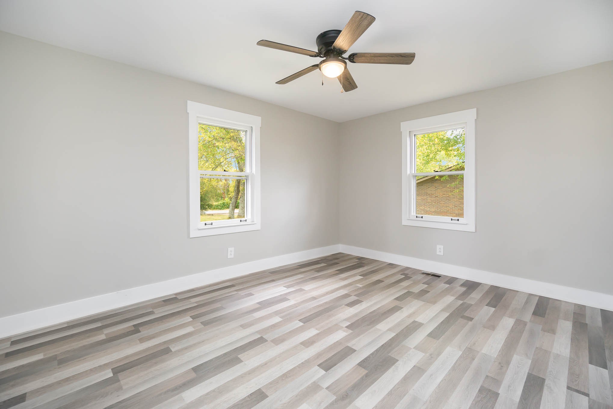 1261 Harrison Road Murfreesboro, TN 37128 - Photo 14 of 24 a view of empty room with wooden floor and fan