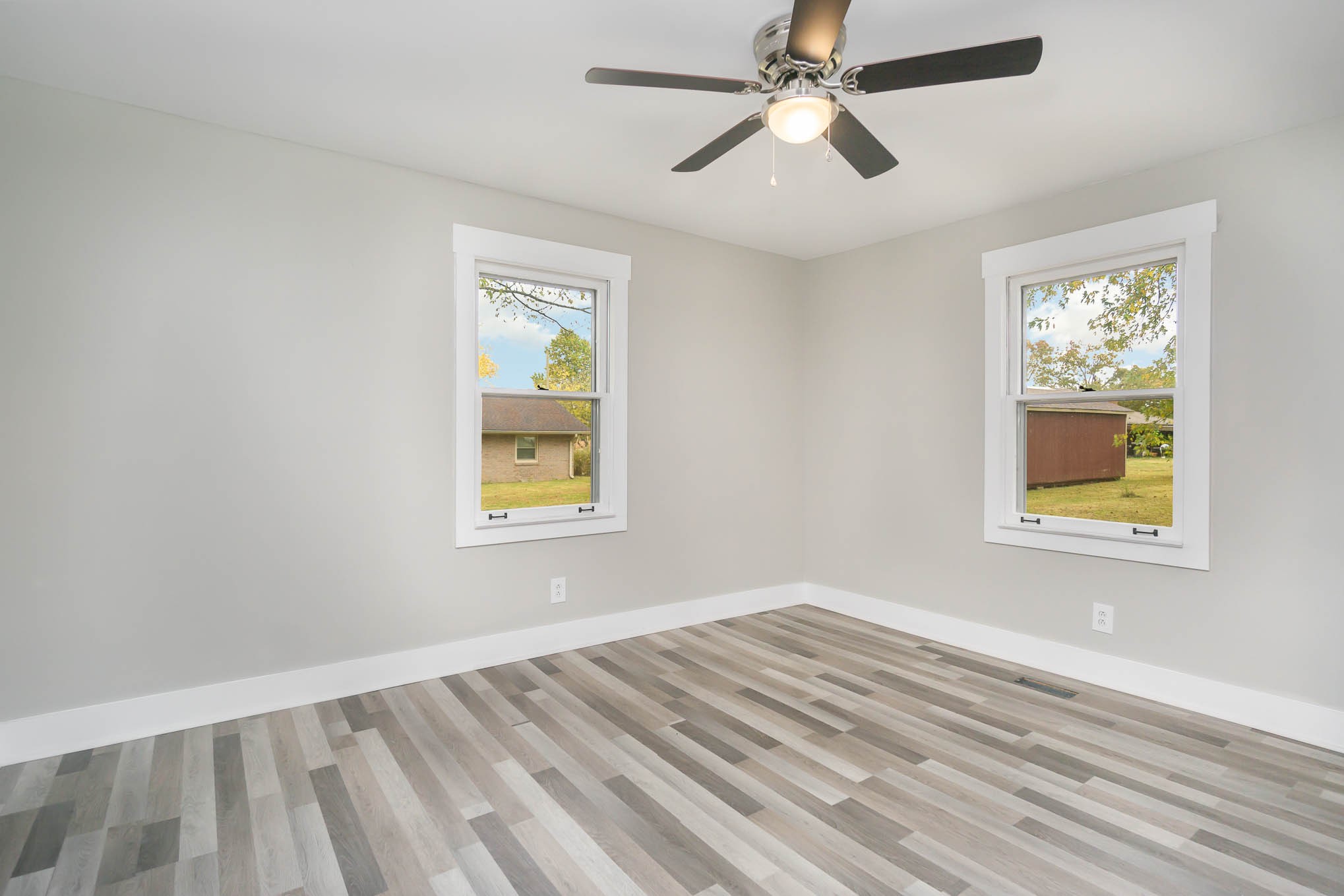 1261 Harrison Road Murfreesboro, TN 37128 - Photo 16 of 24 a view of empty room with wooden floor and fan