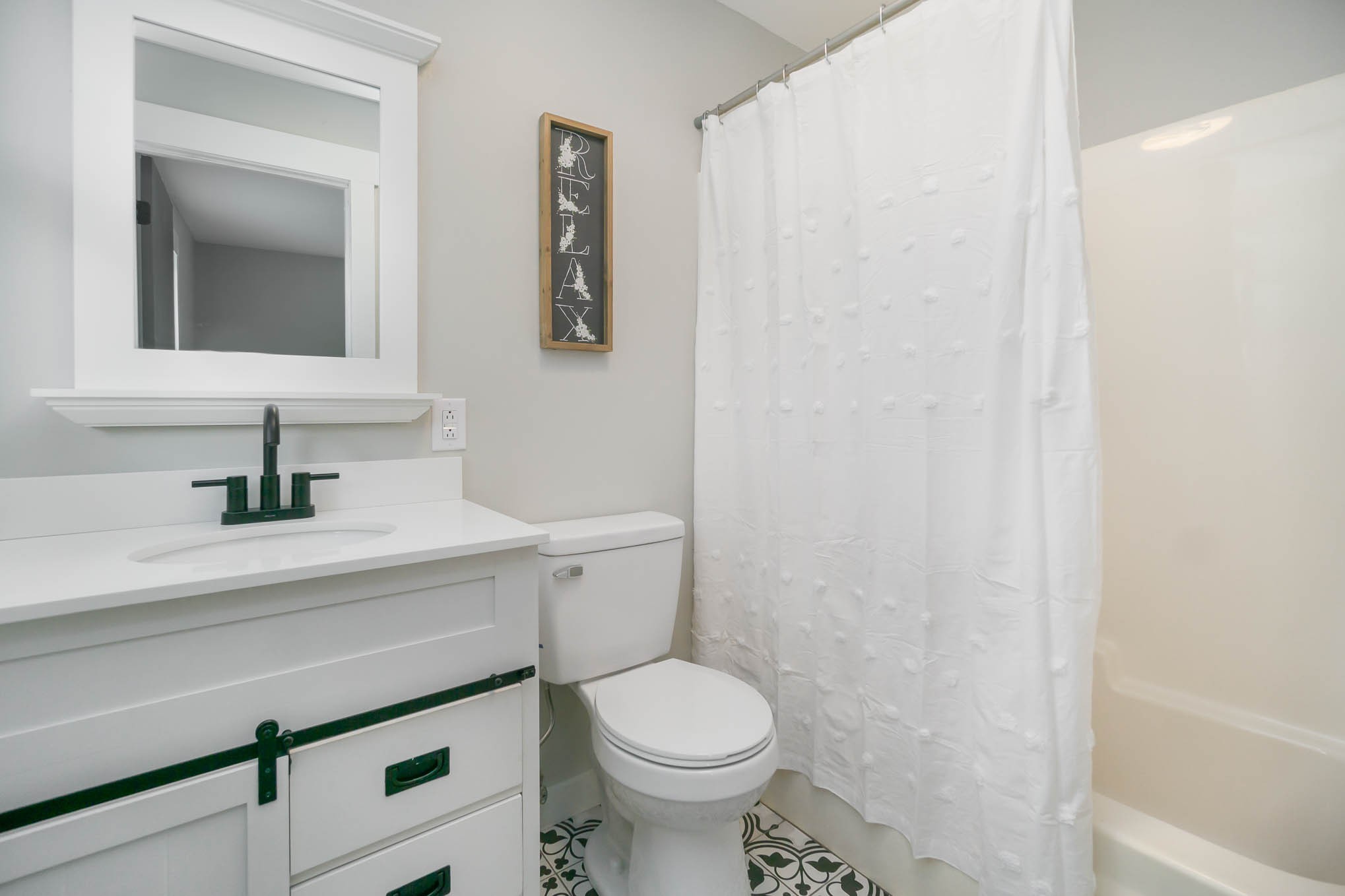 1261 Harrison Road Murfreesboro, TN 37128 - Photo 18 of 24 a bathroom with a sink a toilet and mirror