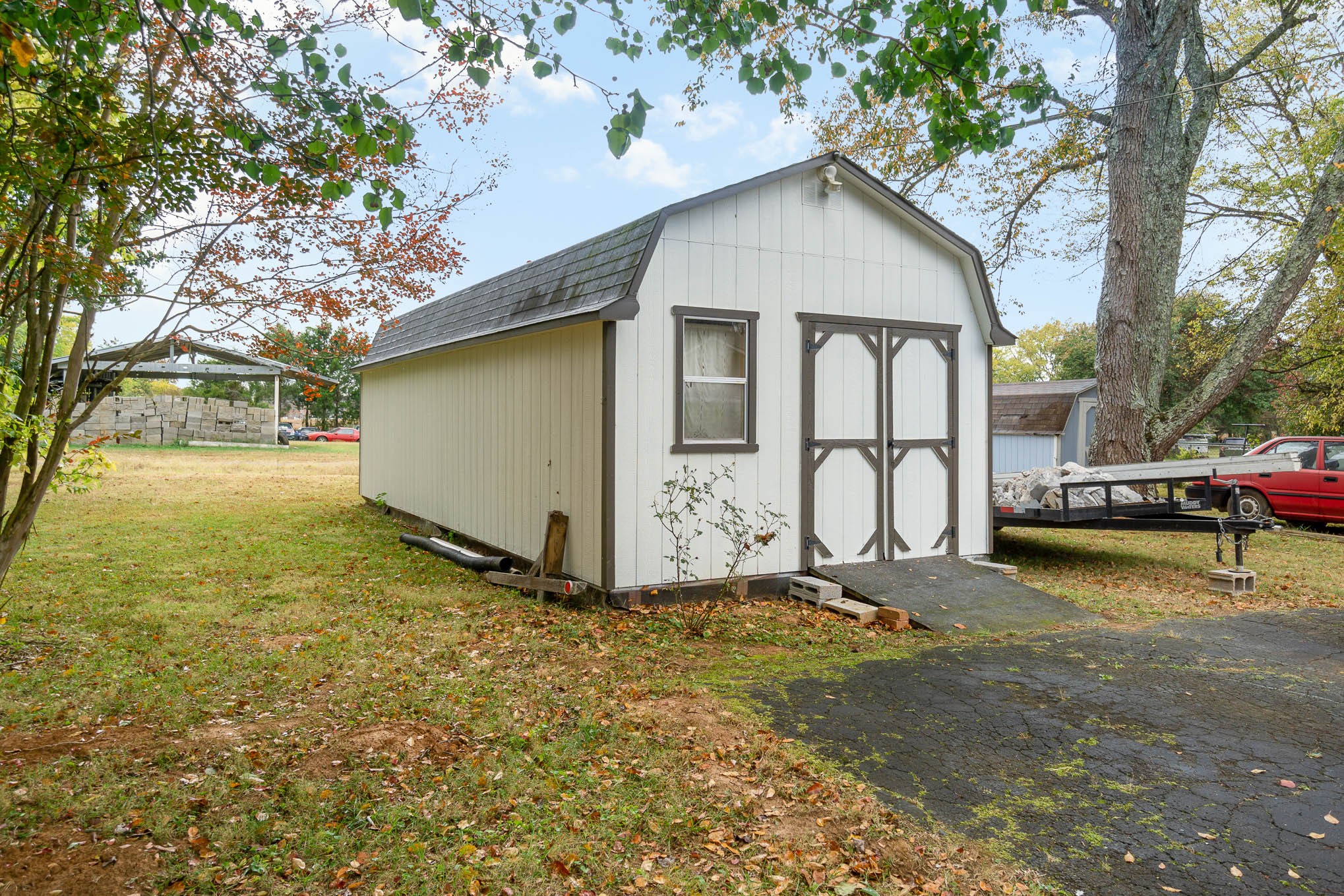 1261 Harrison Road Murfreesboro, TN 37128 - Photo 24 of 24 a white house that has a tree in front of it