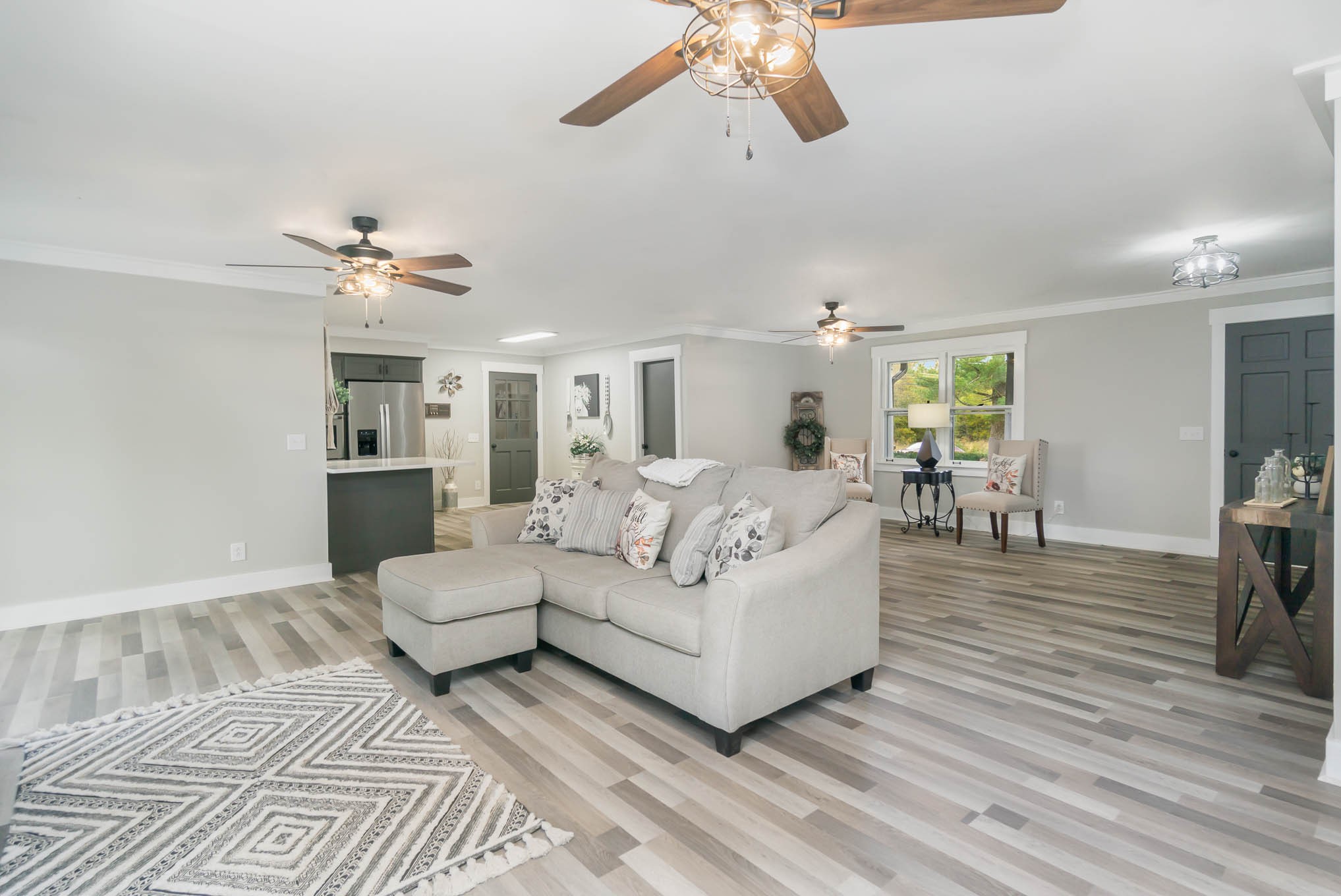 1261 Harrison Road Murfreesboro, TN 37128 - Photo 7 of 24 a living room with furniture and a chandelier