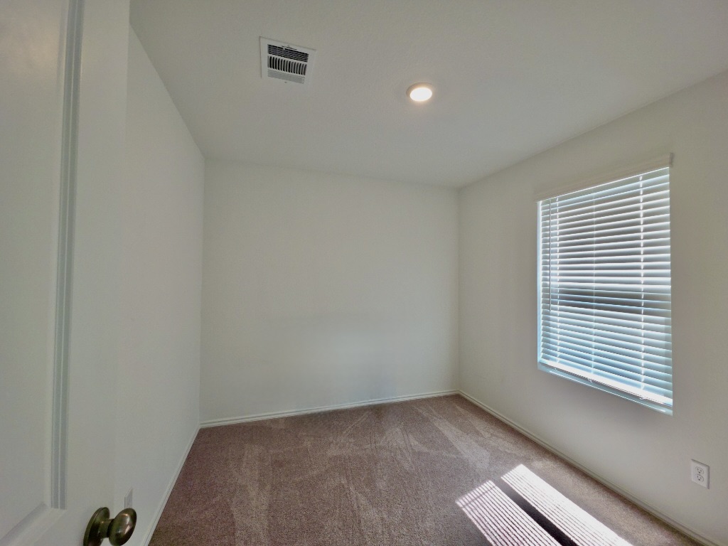 1489 Soapstone Pass Maxwell, TX 78656 - Photo 13 of 20 a view of an empty room with a window