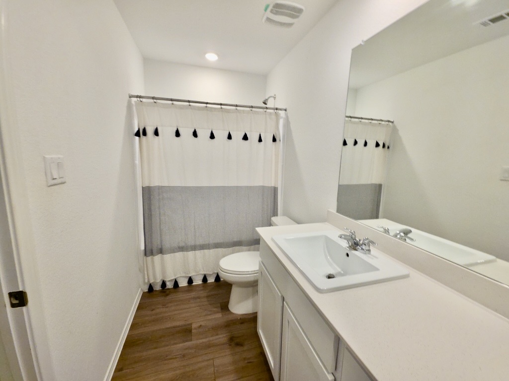 1489 Soapstone Pass Maxwell, TX 78656 - Photo 15 of 20 a bathroom with a sink and a mirror