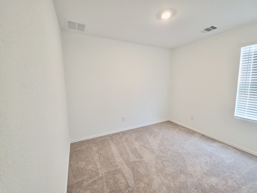 1489 Soapstone Pass Maxwell, TX 78656 - Photo 18 of 20 an empty room with windows