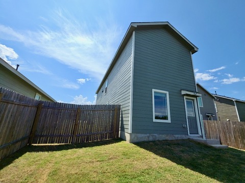 1489 Soapstone Pass Maxwell, TX 78656 - Photo 19 of 20 a view of a backyard