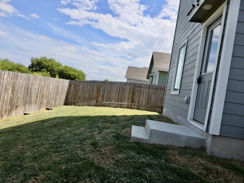 1489 Soapstone Pass Maxwell, TX 78656 - Photo 20 of 20 a view of a backyard with sitting area