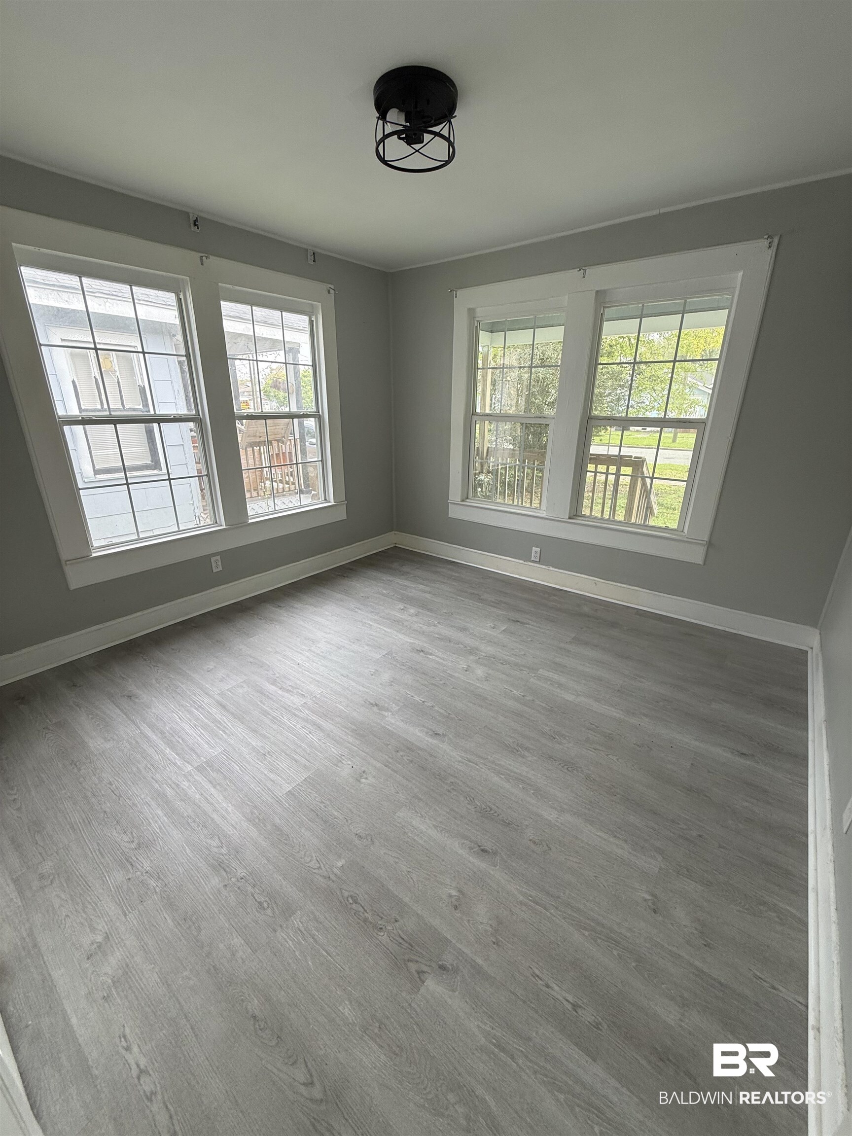 1848 Canal Street Mobile, AL 36606 - Photo 4 of 11 Unfurnished room with baseboards and light wood finished floors