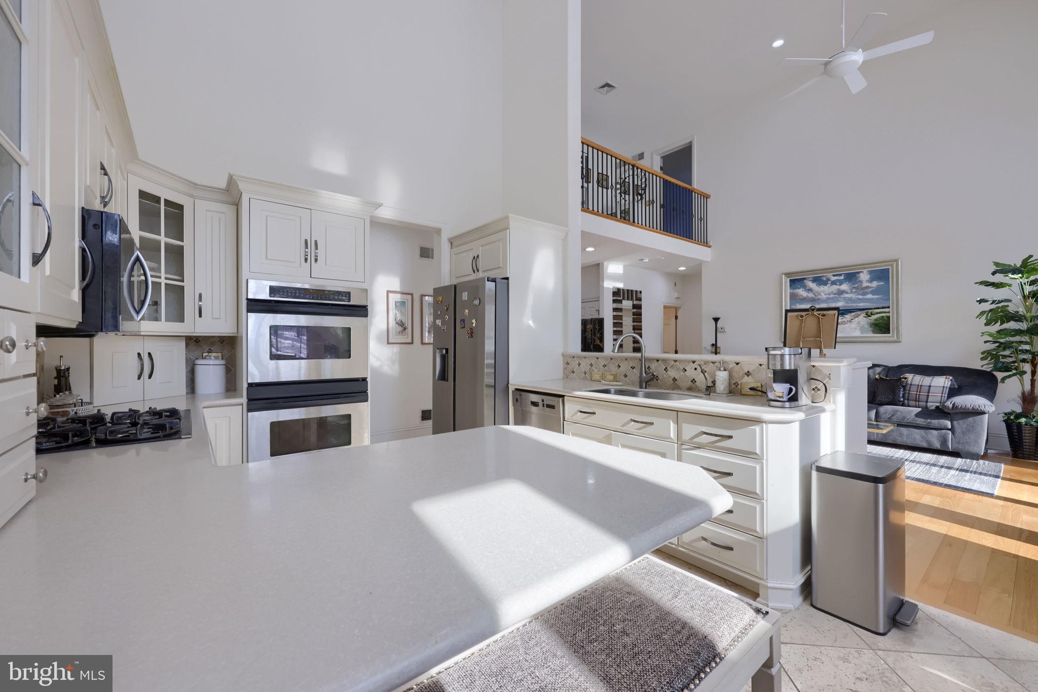 2492 Shaub Road Lancaster, PA 17601 - Photo 104 of 130 a kitchen with stainless steel appliances kitchen island granite countertop a refrigerator oven a sink a stove and white cabinets