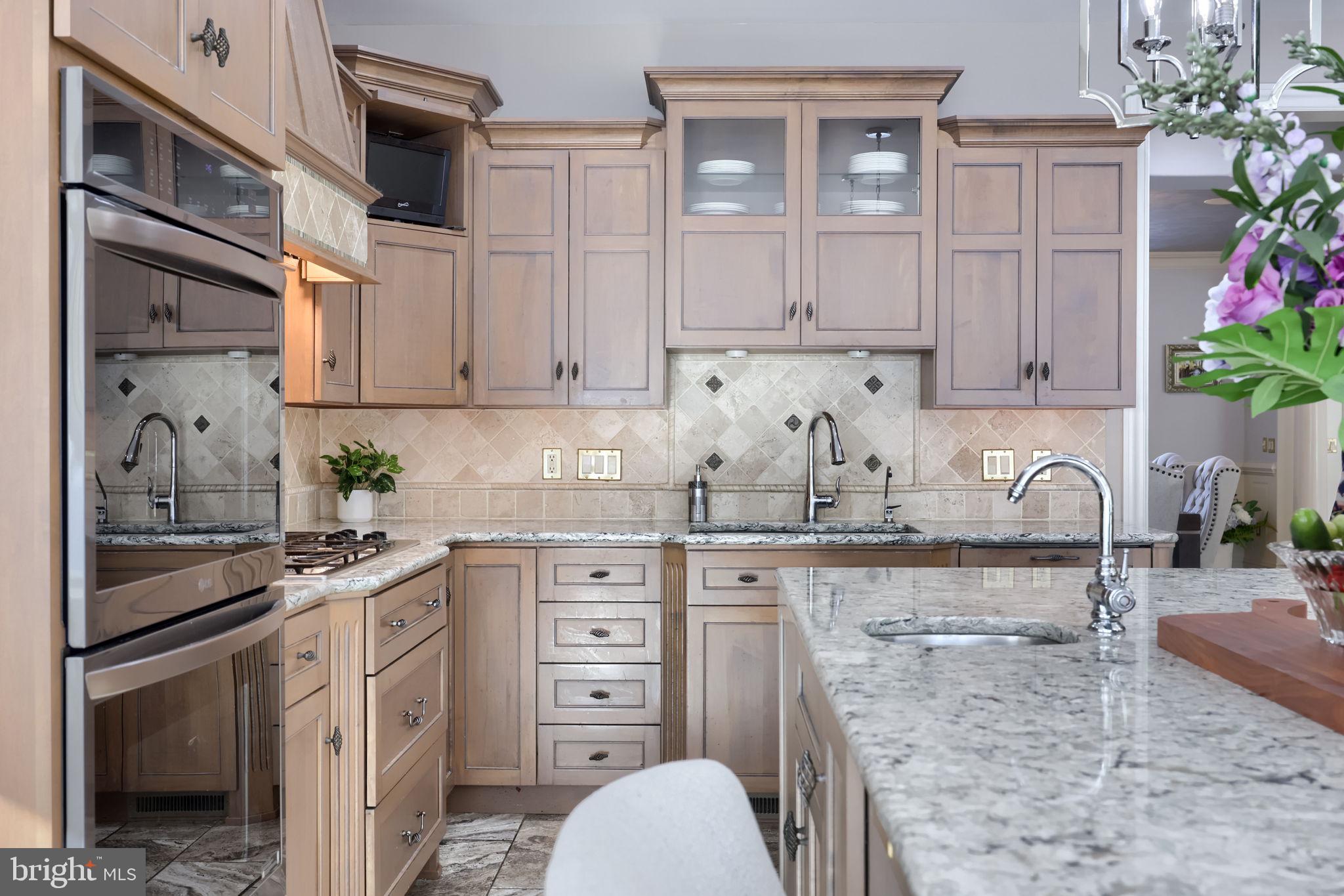 2492 Shaub Road Lancaster, PA 17601 - Photo 92 of 130 a kitchen with stainless steel appliances granite countertop a sink stove and cabinets