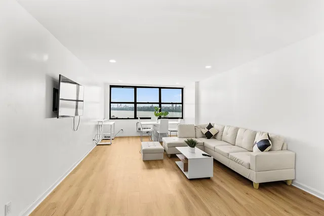 a large kitchen with a refrigerator a sink and dishwasher