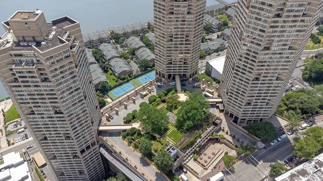 a view of building with outdoor space and lake view