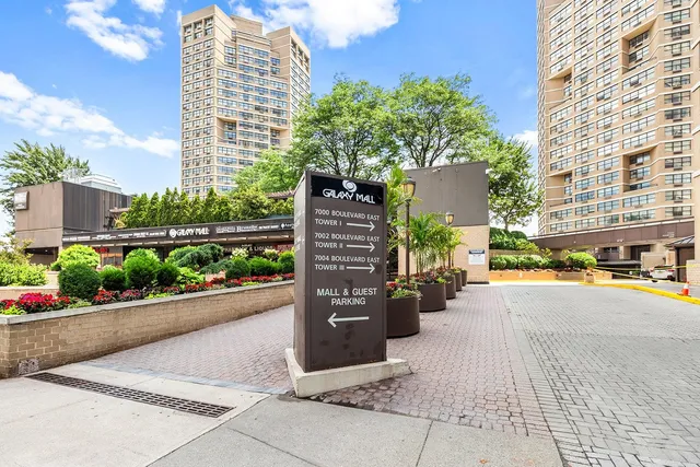 a kitchen with stainless steel appliances granite countertop a sink and a stove