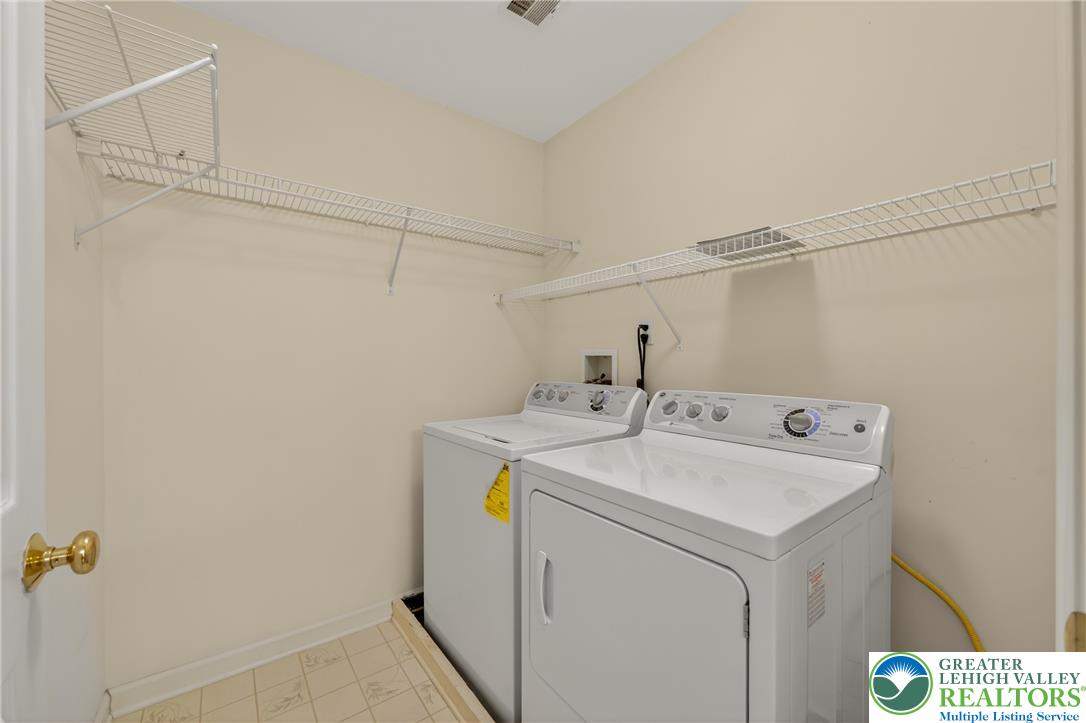 4345 Creek Road Allentown, PA 18104 - Photo 24 of 33 A dedicated utility space with wire shelving, offering practical storage solutions for household tasks.