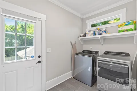 a kitchen with appliances cabinets and a window