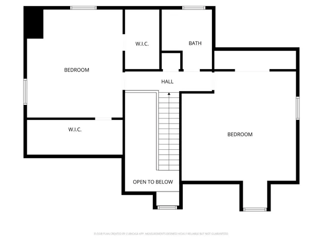 a view of staircase with wooden floor and a potted plant