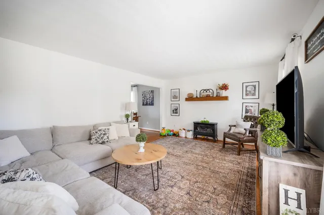 a kitchen with stainless steel appliances granite countertop a refrigerator and a stove