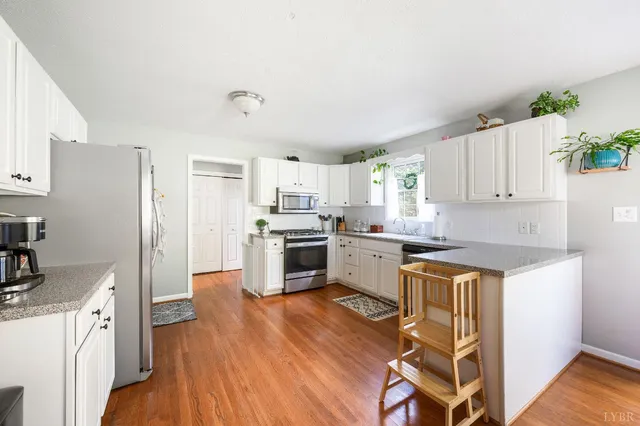a view of an entryway with wooden floor