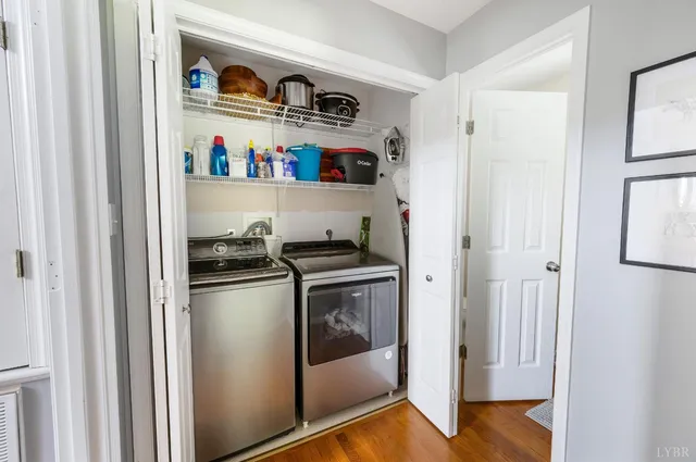 a bedroom with furniture and a chandelier