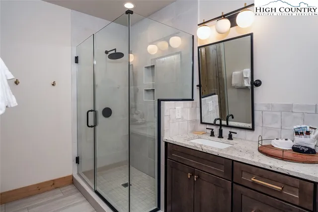 a front view of a house with a yard and plant