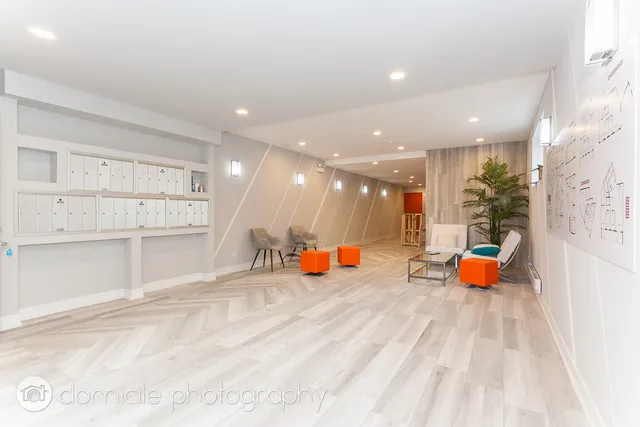 a view of a living room and kitchen with furniture wooden floor and window