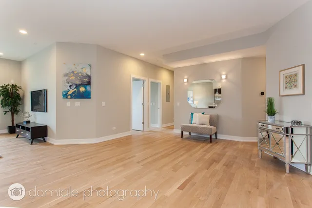 a living room with stainless steel appliances kitchen island granite countertop furniture and a kitchen view
