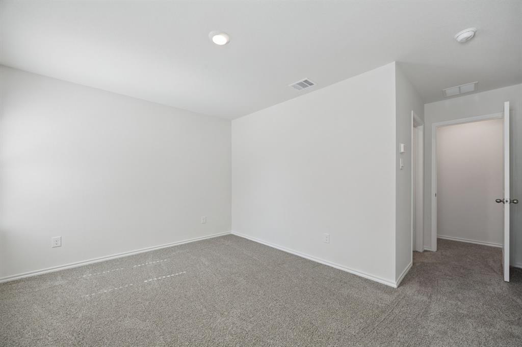 323 Clematis Street Princeton, TX 75407 - Photo 23 of 34 Empty room with carpet floors and recessed lighting