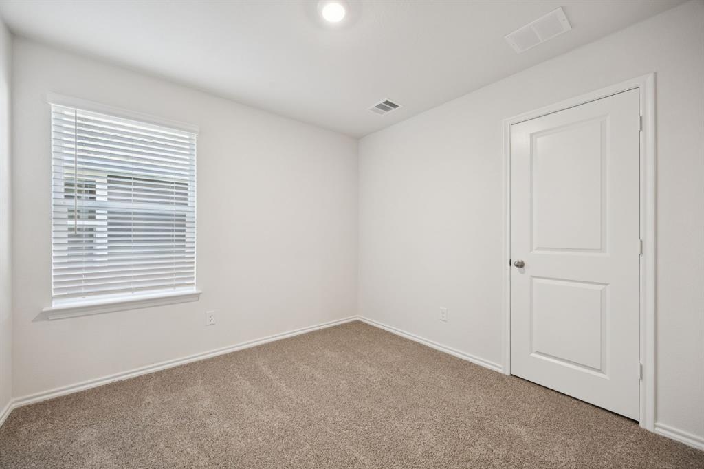 323 Clematis Street Princeton, TX 75407 - Photo 25 of 34 Carpeted empty room with baseboards