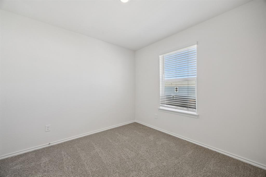 323 Clematis Street Princeton, TX 75407 - Photo 26 of 34 Empty room featuring baseboards and carpet flooring