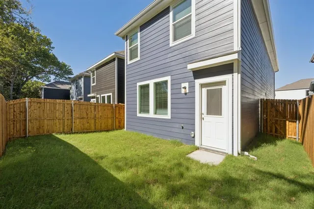 a view of an house with backyard space and garden