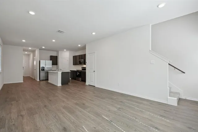a view of kitchen with wooden floor