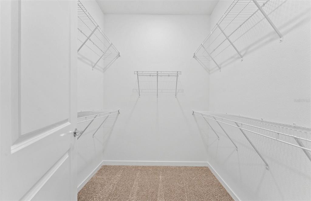 13748 Rocky Pne Place Spring Hill, FL 34610 - Photo 12 of 30 a view of a room with racks on the wall