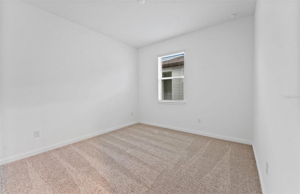 13748 Rocky Pne Place Spring Hill, FL 34610 - Photo 13 of 30 an empty room with a window