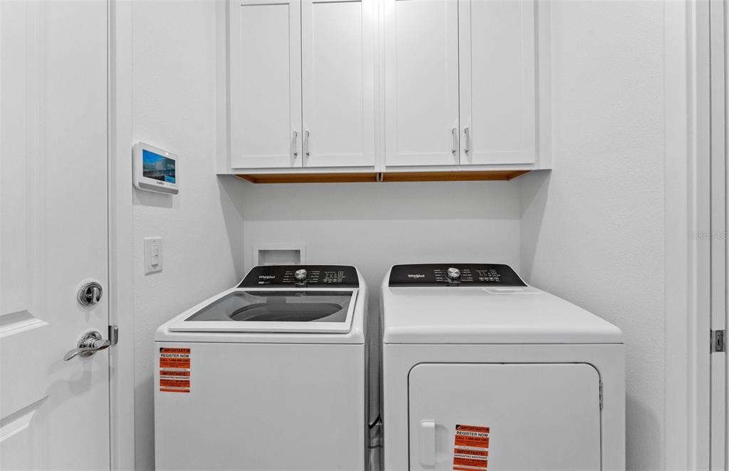 13748 Rocky Pne Place Spring Hill, FL 34610 - Photo 15 of 30 a utility room with dryer and washer